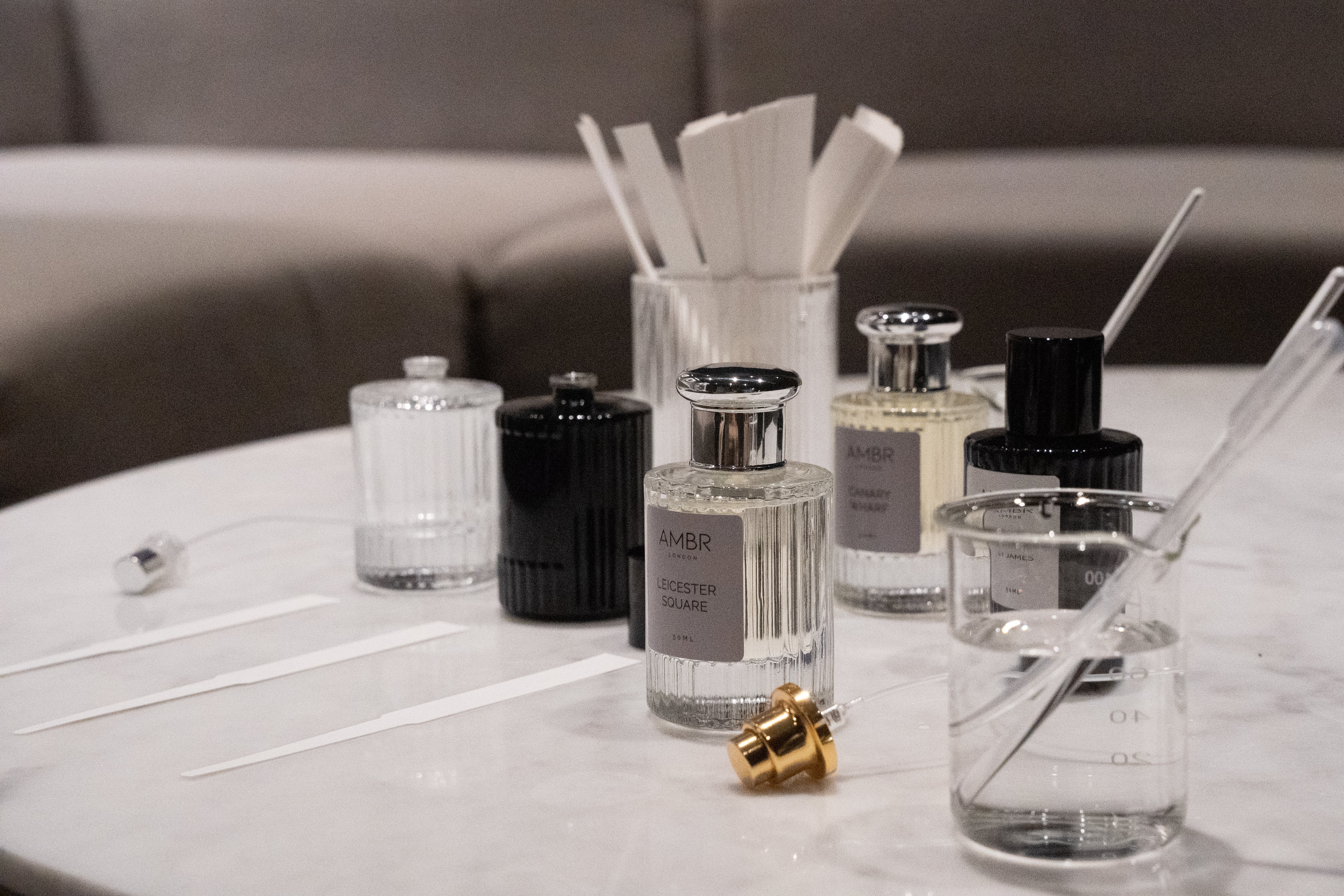 Collection of dupe perfume bottles and accessories on a table