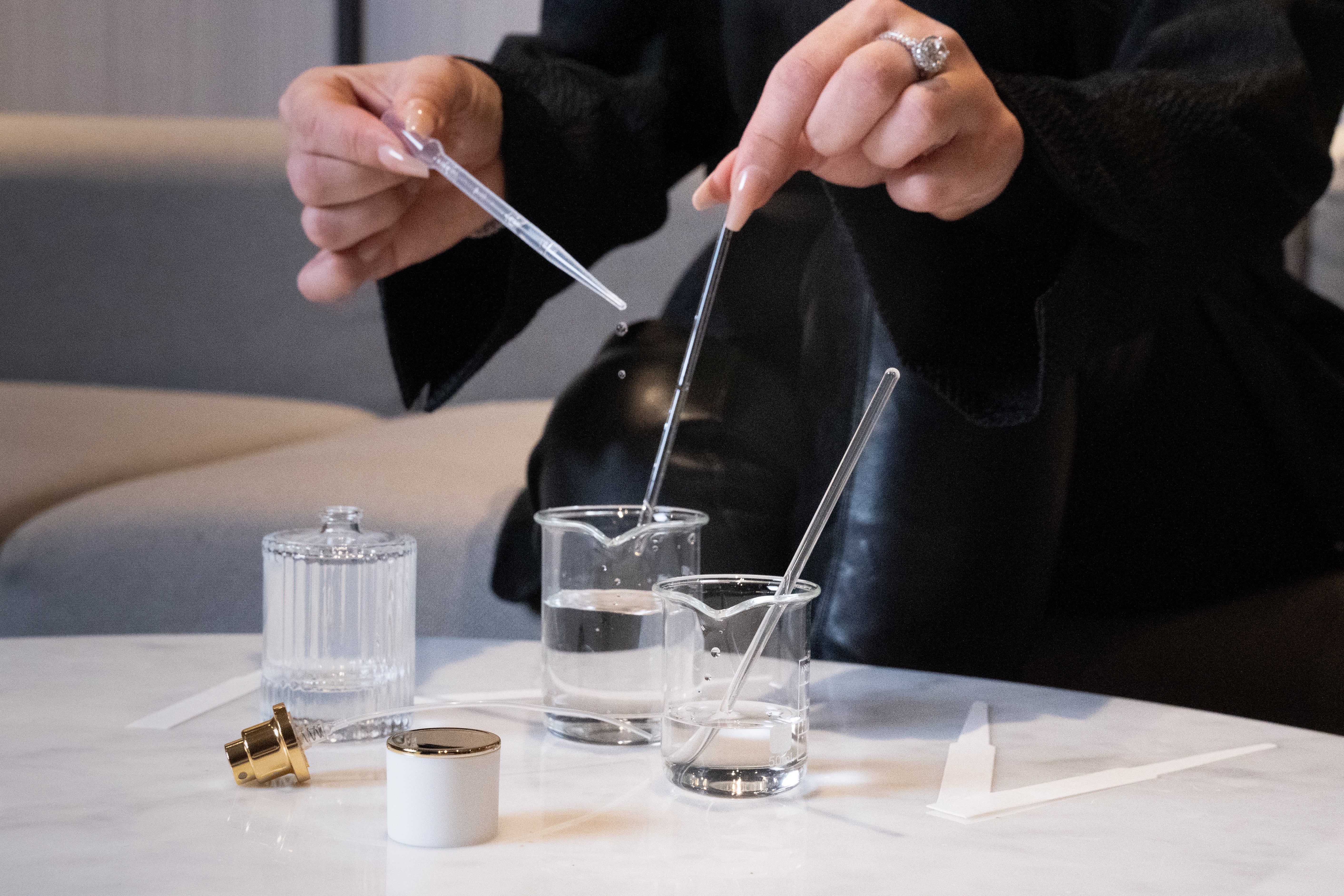 woman making dupe perfumes